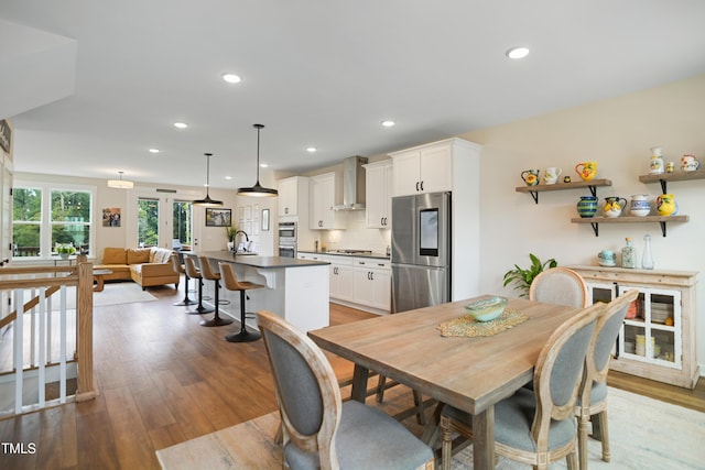 2055 Eva Pearl Dr, Apex, NC 27502 - dining space with recessed lighting and light wood-type flooring
