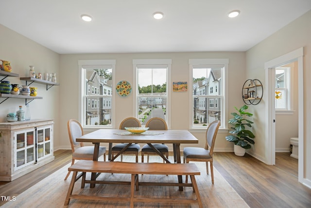 2055 Eva Pearl Dr, Apex, NC 27502 - dining area with healthy amount of natural light, light wood-style floors, and recessed lighting