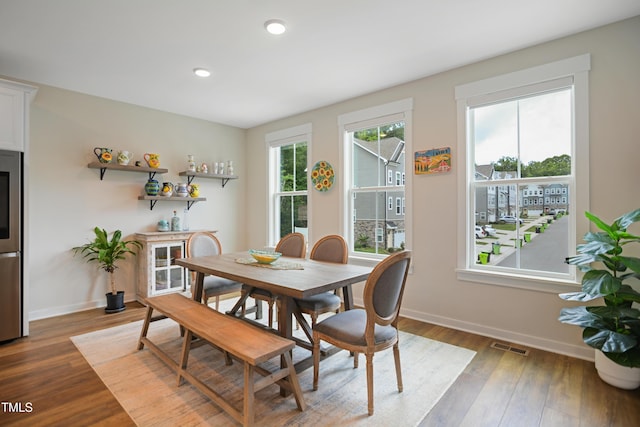 2055 Eva Pearl Dr, Apex, NC 27502 - dining space featuring wood finished floors and recessed lighting