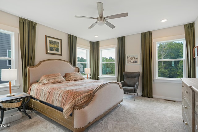 2055 Eva Pearl Dr, Apex, NC 27502 - bedroom with light colored carpet, a ceiling fan, and recessed lighting