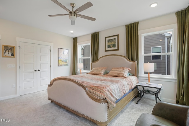 2055 Eva Pearl Dr, Apex, NC 27502 - bedroom with light carpet, a closet, recessed lighting, and ceiling fan