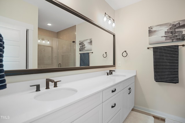 2055 Eva Pearl Dr, Apex, NC 27502 - bathroom featuring double vanity and a shower stall