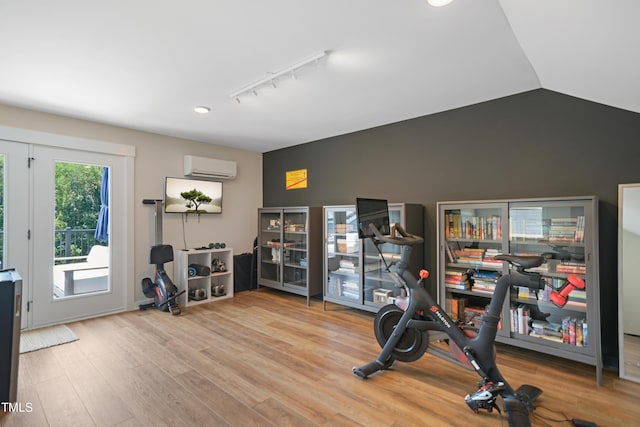 2055 Eva Pearl Dr, Apex, NC 27502 - workout area with a wall unit AC, rail lighting, wood finished floors, recessed lighting, and vaulted ceiling
