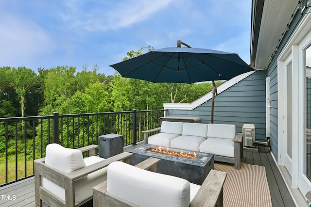 2055 Eva Pearl Dr, Apex, NC 27502 - deck featuring an outdoor living space with a fire pit and a view of trees