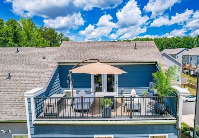 2055 Eva Pearl Dr, Apex, NC 27502 - back of property featuring a shingled roof and a balcony