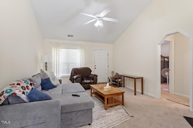 5104 Parkerwood Dr, Knightdale, NC 27545 - living room with arched walkways, vaulted ceiling, light carpet, and a ceiling fan