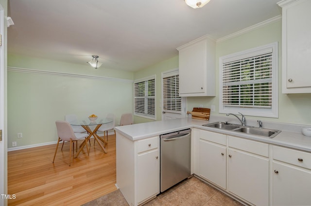 8 Mandy Ct, Durham, NC 27707 - kitchen with dishwasher, a peninsula, white cabinets, light countertops, and crown molding