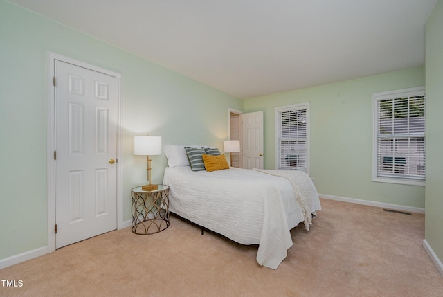 8 Mandy Ct, Durham, NC 27707 - carpeted bedroom with baseboards
