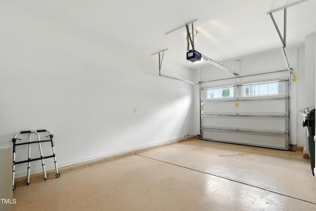 9201 Wooden Rd, Raleigh, NC 27617 - garage with a garage door opener and baseboards