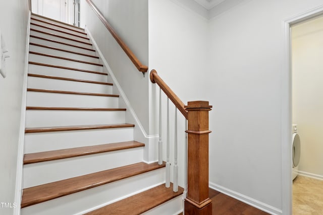 9201 Wooden Rd, Raleigh, NC 27617 - stairway with crown molding and washer / dryer