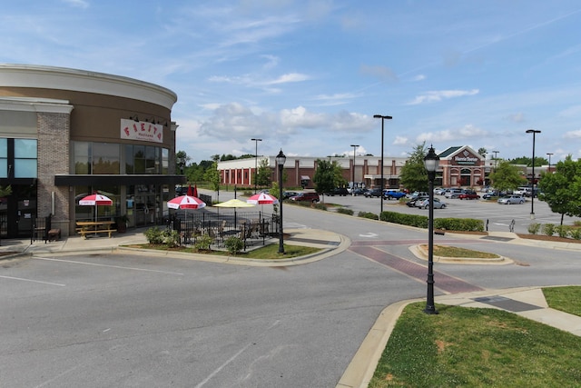 317 Calvander Ln, Apex, NC 27539 - view of asphalt street featuring street lights, curbs, and sidewalks