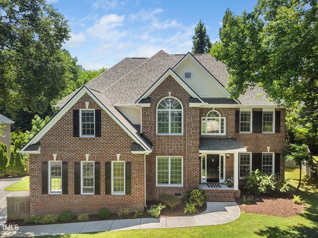 3811 Cottonwood Dr, Durham, NC 27705 - colonial home featuring brick siding and a shingled roof