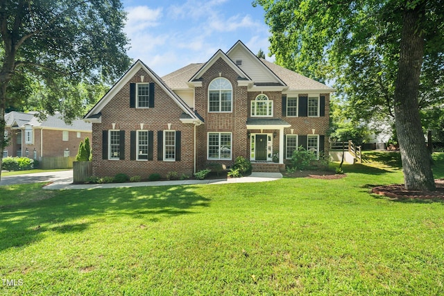 3811 Cottonwood Dr, Durham, NC 27705 - view of front of property featuring brick siding and a front lawn