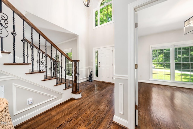 3811 Cottonwood Dr, Durham, NC 27705 - entryway featuring dark wood-style flooring, a towering ceiling, and stairway