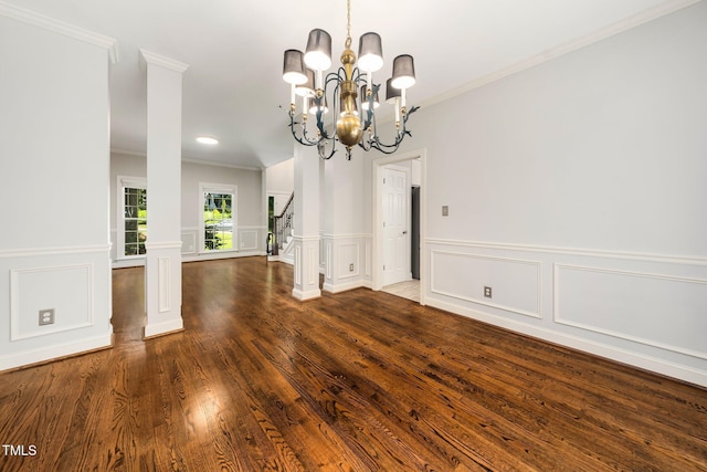 3811 Cottonwood Dr, Durham, NC 27705 - spare room featuring ornamental molding, wood finished floors, a decorative wall, a chandelier, and wainscoting