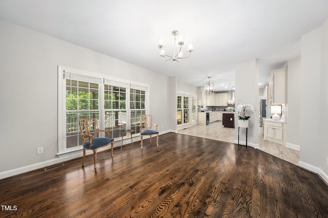 3811 Cottonwood Dr, Durham, NC 27705 - living area with a chandelier and light wood-style flooring