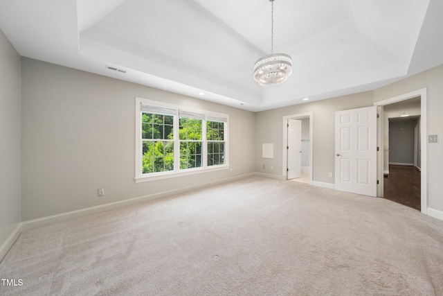 3811 Cottonwood Dr, Durham, NC 27705 - unfurnished bedroom with a raised ceiling, a chandelier, carpet floors, ensuite bathroom, and recessed lighting