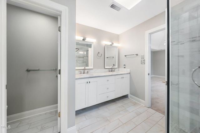 3811 Cottonwood Dr, Durham, NC 27705 - full bath with marble look tiles, double vanity, and a shower stall