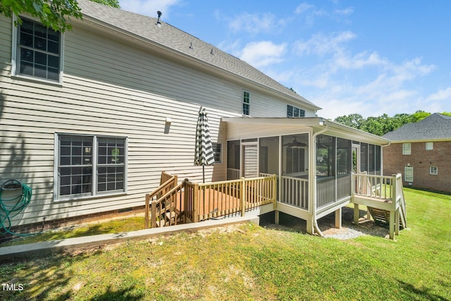 3811 Cottonwood Dr, Durham, NC 27705 - rear view of property featuring a sunroom and a lawn