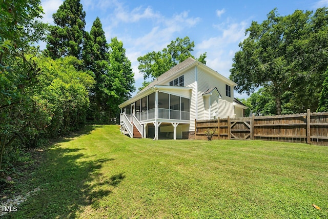 3811 Cottonwood Dr, Durham, NC 27705 - rear view of house featuring a sunroom, a fenced backyard, and a gate