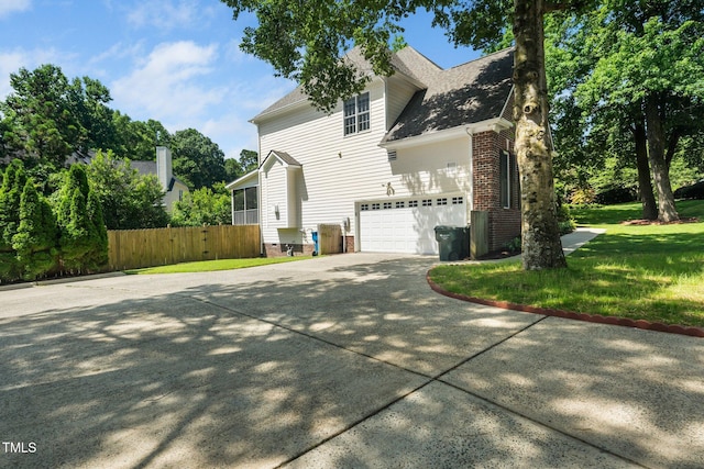 3811 Cottonwood Dr, Durham, NC 27705 - view of property exterior featuring driveway, a garage, and roof with shingles