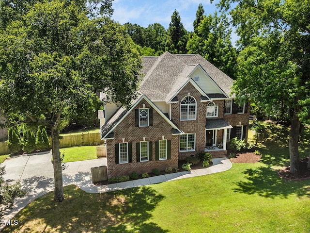 3811 Cottonwood Dr, Durham, NC 27705 - view of front of house featuring brick siding, a shingled roof, and concrete driveway