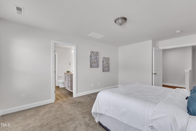 3505 Triad Ct, Raleigh, NC 27604 - carpeted bedroom with baseboards and connected bathroom