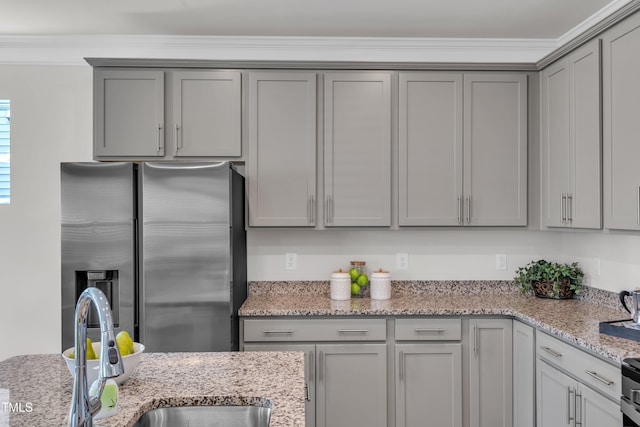 3505 Triad Ct, Raleigh, NC 27604 - kitchen with stainless steel fridge with ice dispenser, gray cabinetry, crown molding, and light stone counters