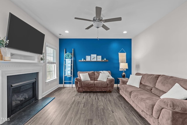 1214 Valley Dale Dr, Fuquay Varina, NC 27526 - living area with ceiling fan, recessed lighting, a glass covered fireplace, and wood finished floors