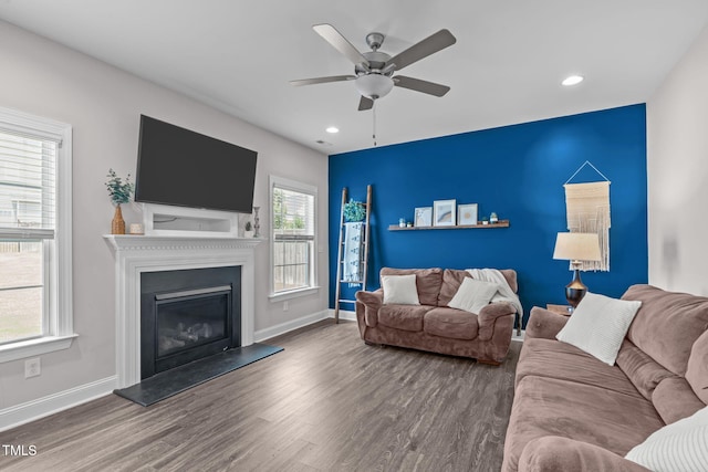 1214 Valley Dale Dr, Fuquay Varina, NC 27526 - living area featuring wood finished floors, a ceiling fan, recessed lighting, and a glass covered fireplace
