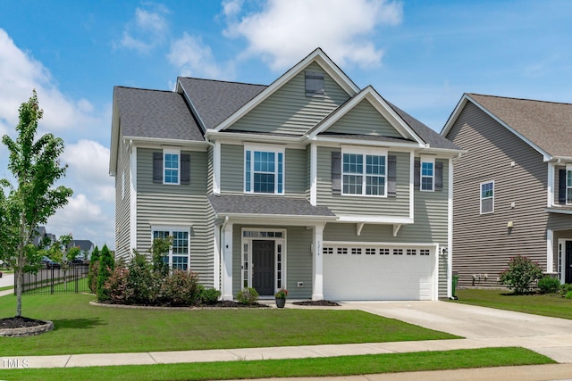 1214 Valley Dale Dr, Fuquay Varina, NC 27526 - view of front facade with driveway, an attached garage, and roof with shingles