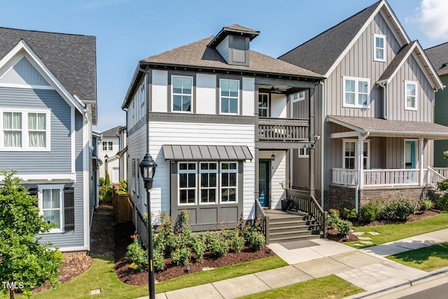 1008 Whistler St, Durham, NC 27713 - view of front of house featuring a balcony, a porch, board and batten siding, and a shingled roof