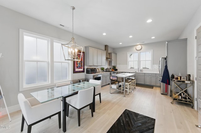 1008 Whistler St, Durham, NC 27713 - dining space with a chandelier, light wood finished floors, and recessed lighting