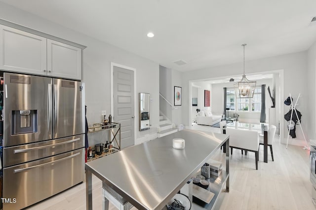 1008 Whistler St, Durham, NC 27713 - kitchen with stainless steel fridge, light wood-style flooring, recessed lighting, and pendant lighting