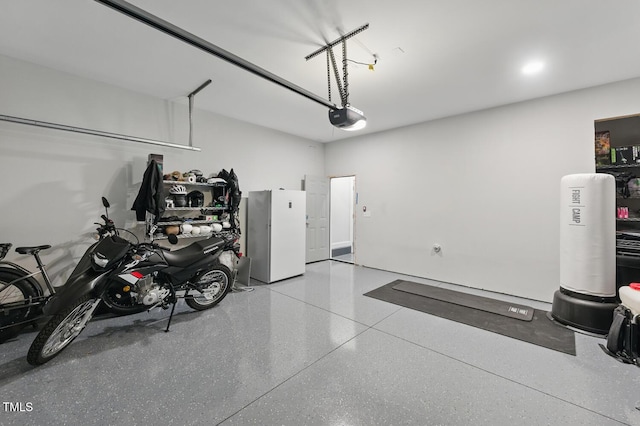 1008 Whistler St, Durham, NC 27713 - garage with freestanding refrigerator and a garage door opener