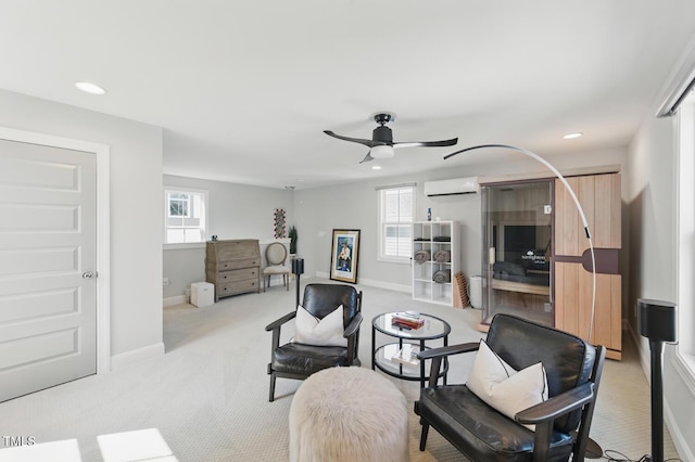 1008 Whistler St, Durham, NC 27713 - living area featuring an AC wall unit, a ceiling fan, recessed lighting, light colored carpet, and plenty of natural light
