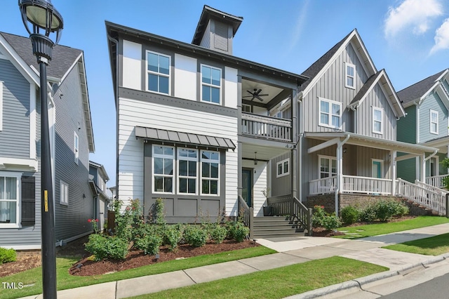 1008 Whistler St, Durham, NC 27713 - view of front of home featuring board and batten siding, a balcony, a ceiling fan, and a porch
