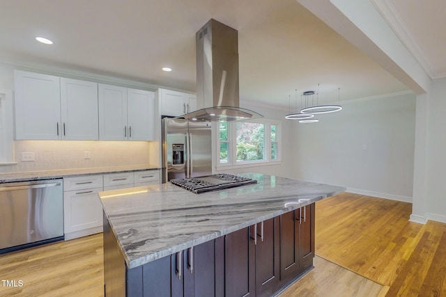 303 Winhaven St, Roxboro, NC 27573 - kitchen featuring stainless steel appliances, island range hood, white cabinets, light stone countertops, and crown molding