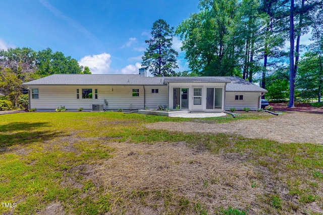 303 Winhaven St, Roxboro, NC 27573 - rear view of property featuring a chimney and a lawn