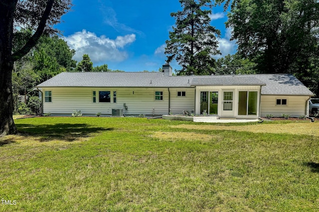 303 Winhaven St, Roxboro, NC 27573 - rear view of house with a lawn and a chimney