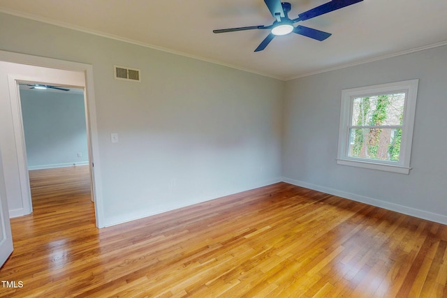 303 Winhaven St, Roxboro, NC 27573 - empty room featuring light wood-style flooring, a ceiling fan, and crown molding
