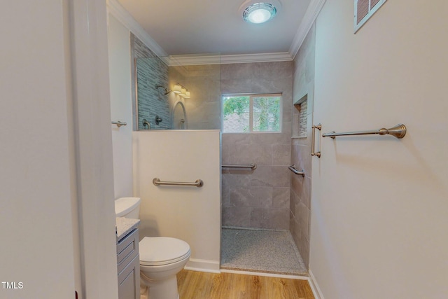 303 Winhaven St, Roxboro, NC 27573 - bathroom with ornamental molding, a walk in shower, wood finished floors, and vanity