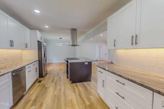 303 Winhaven St, Roxboro, NC 27573 - kitchen featuring island exhaust hood, appliances with stainless steel finishes, backsplash, white cabinetry, and recessed lighting