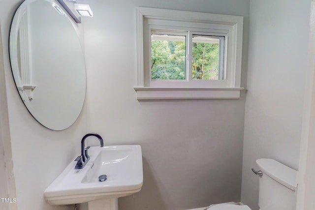 303 Winhaven St, Roxboro, NC 27573 - bathroom with toilet and a sink