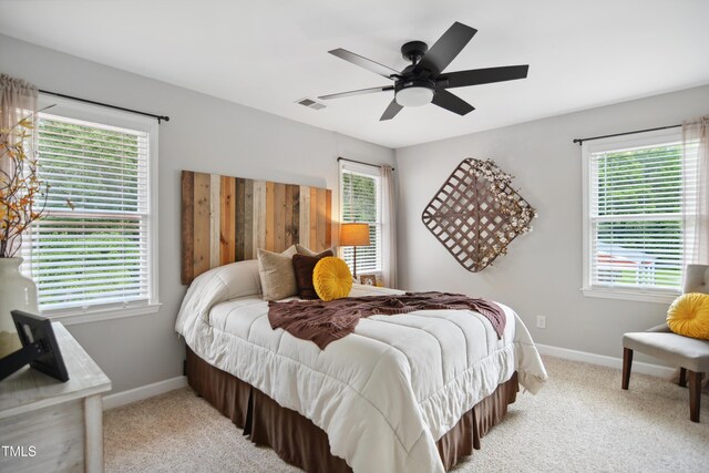 633 Fleming Rd, Youngsville, NC 27596 - carpeted bedroom with baseboards and ceiling fan