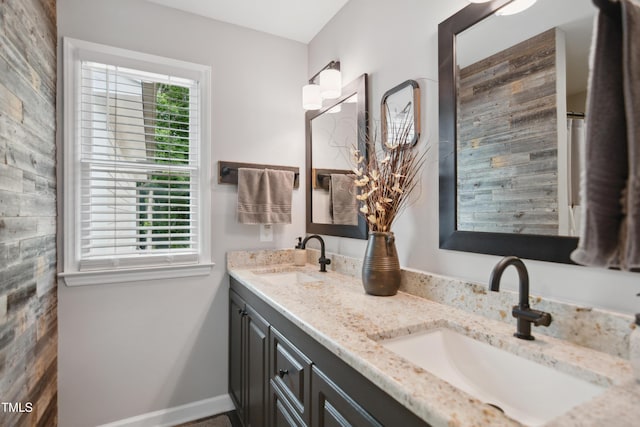 633 Fleming Rd, Youngsville, NC 27596 - full bathroom featuring double vanity and baseboards