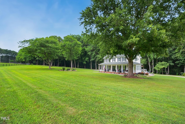 633 Fleming Rd, Youngsville, NC 27596 - view of yard with a porch and view of wooded area