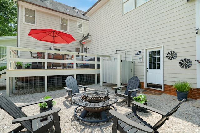 633 Fleming Rd, Youngsville, NC 27596 - back of property featuring a fire pit, a deck, and a patio area