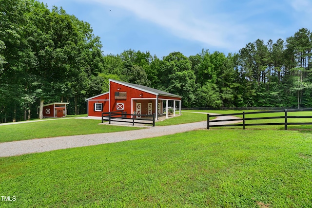 633 Fleming Rd, Youngsville, NC 27596 - view of yard featuring an outbuilding and an exterior structure