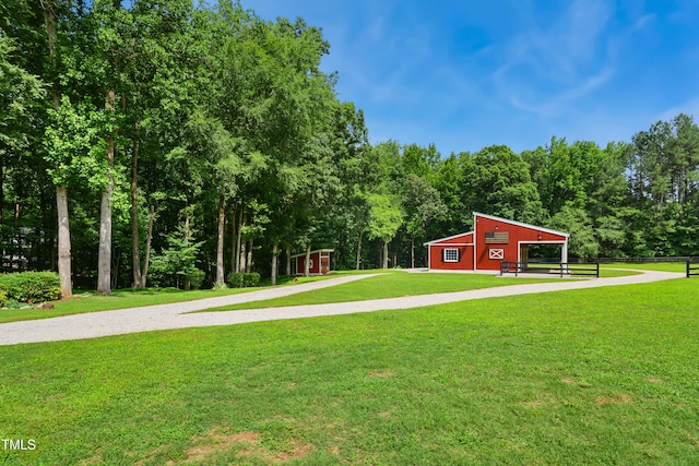 633 Fleming Rd, Youngsville, NC 27596 - view of yard featuring an outdoor structure and an outbuilding
